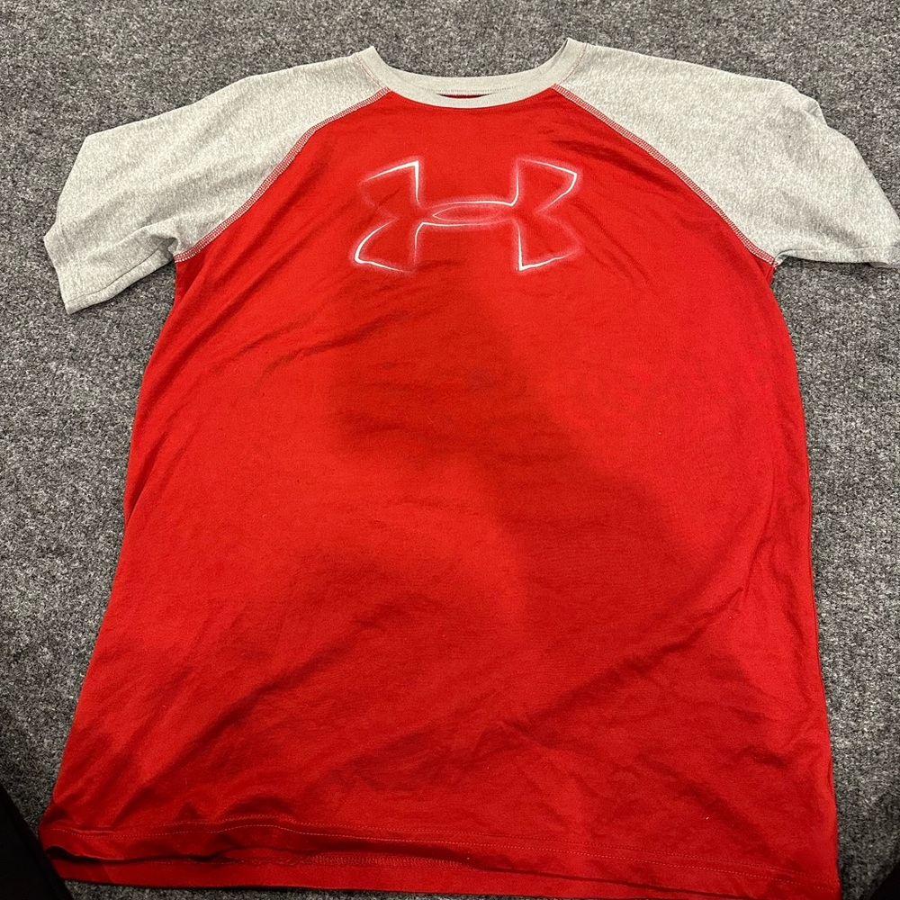 Red Under Armour t-shirt with grey sleeves.